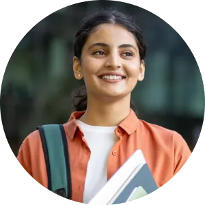 a woman holding a book and smiling