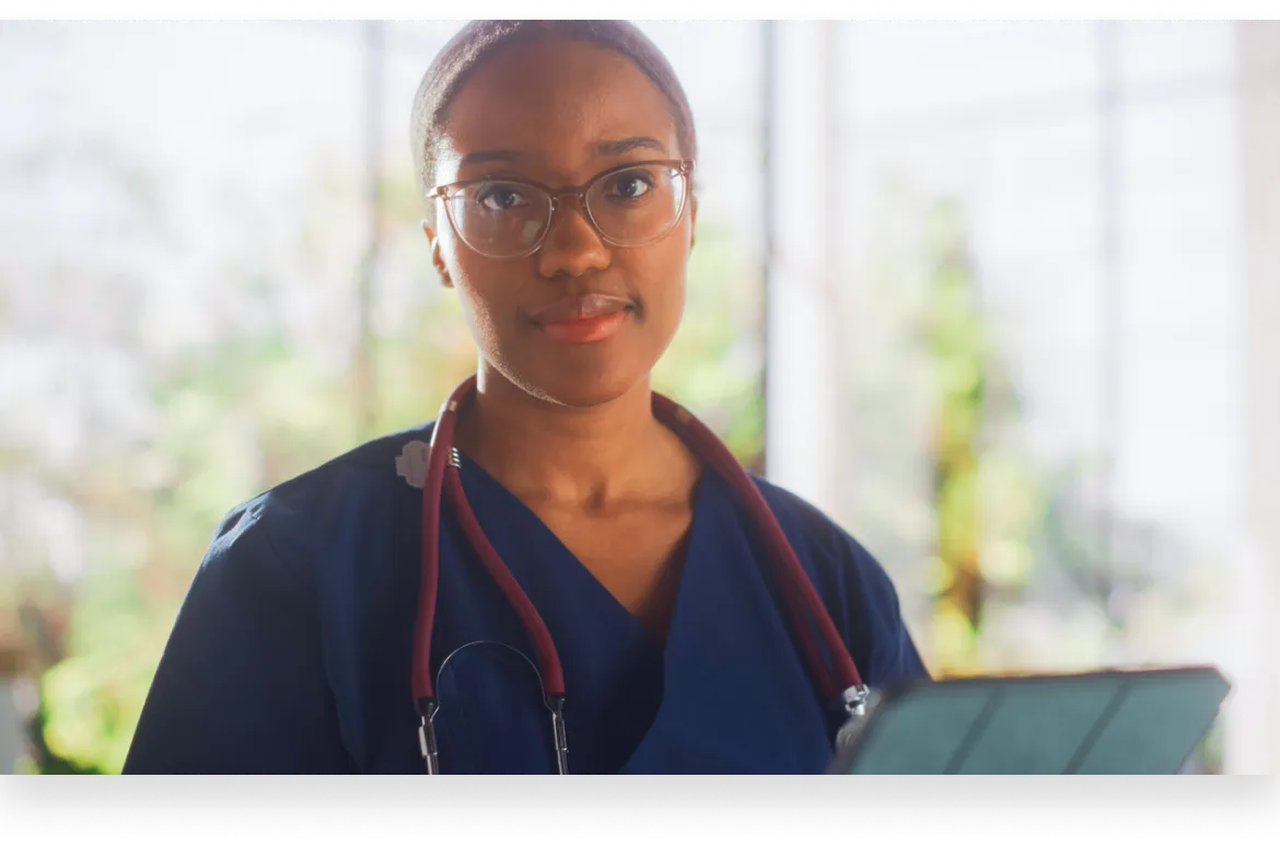 a medical assistant looking over a patient’s chart as part of a clinical medical assistant training program