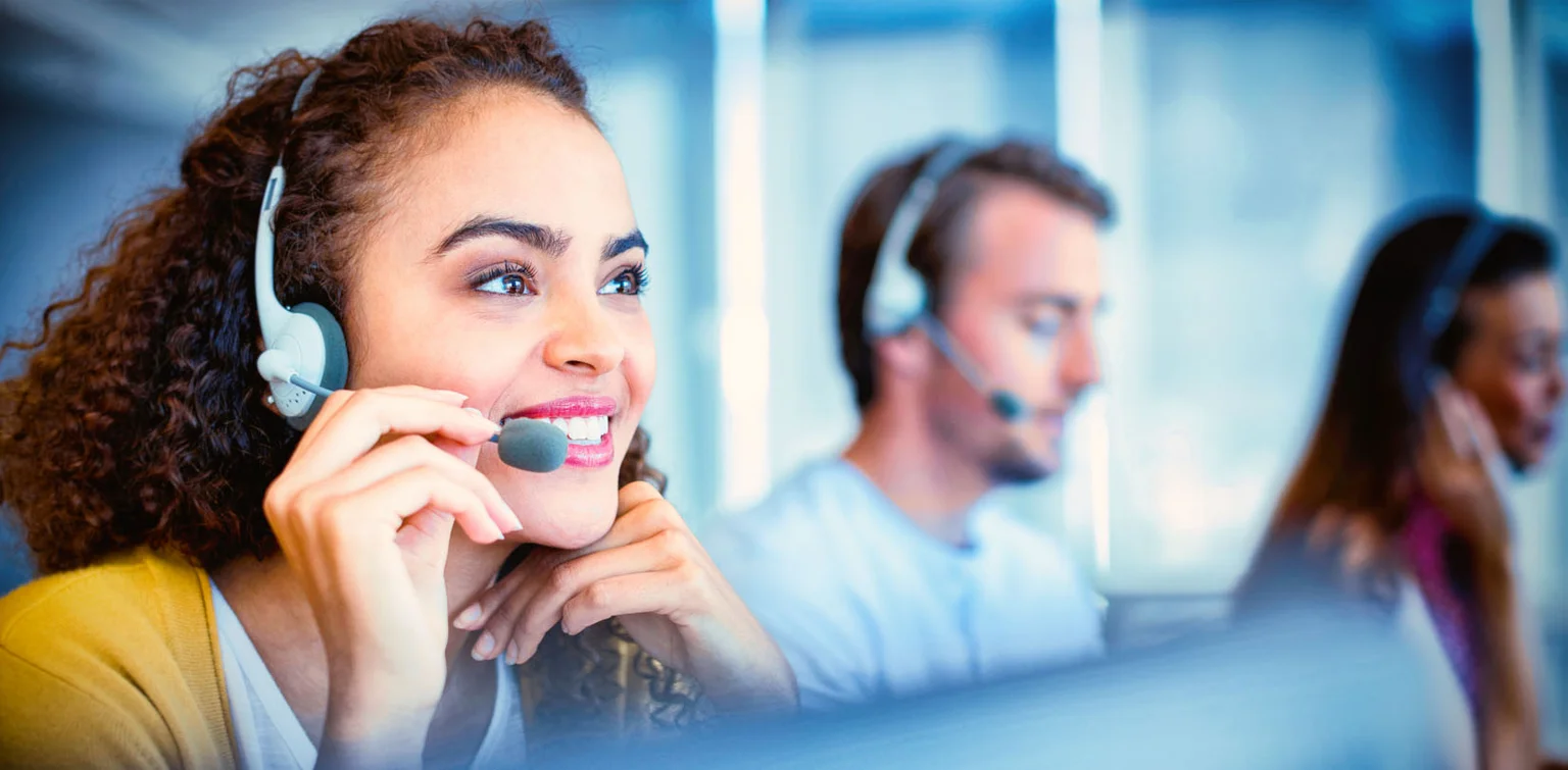 A woman talking on the phone and smiling